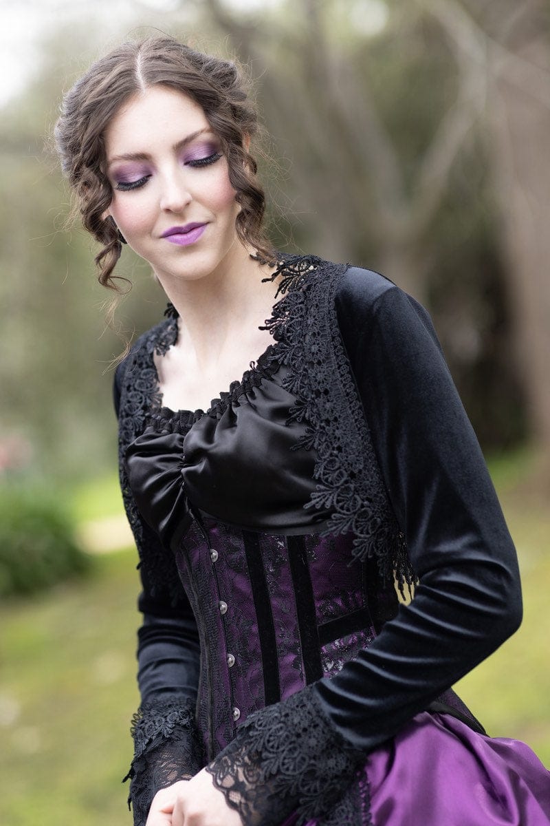 side view of Florencia Inferno model wearing Gallery Serpentine amethyst and black gothic victorian corset gown