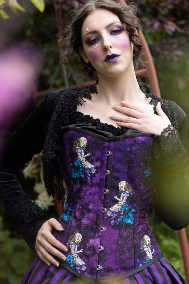 close up on the steel boned custom sized Alice in Wonderland corset from Gallery Serpentine featuring images of Alice