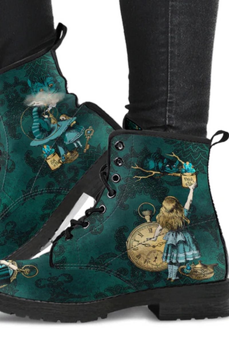 Green Alice in Wonderland vegan boots featuring a vivid dark green cheshire cat, Alice, the Drink Me bottle and a gold pocket watch