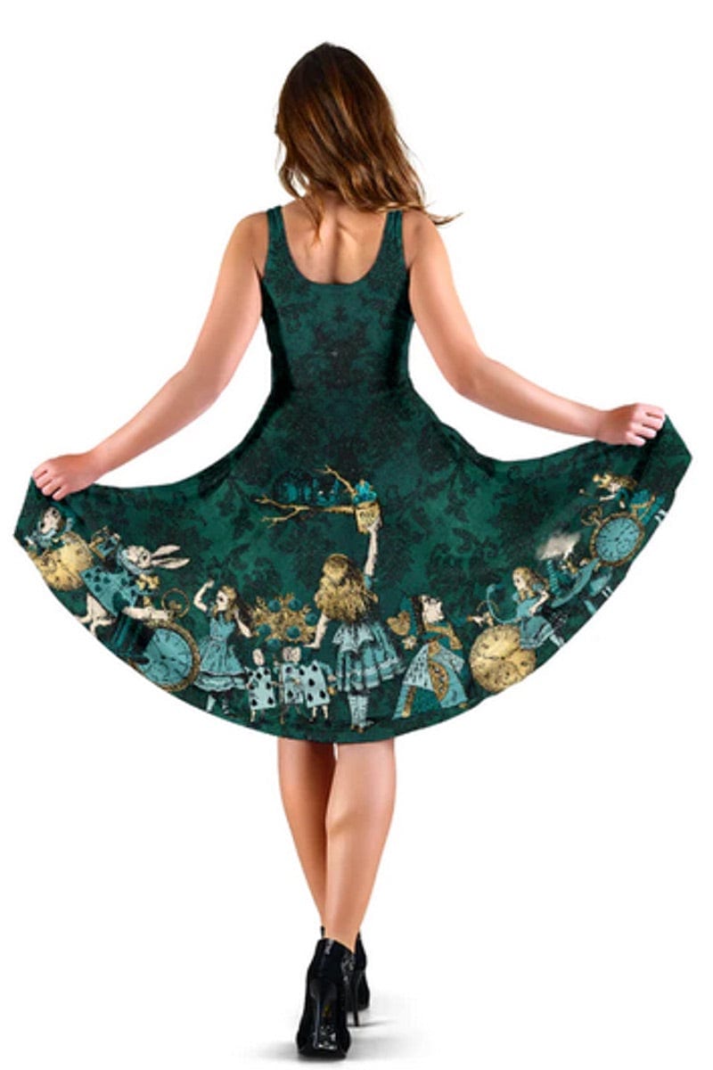 back view of the woman wearing the dark green Alice in Wonderland summer dress printed with the Alice in Wonderland characters on the border