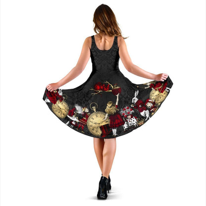 back view of the gothic red and black and gold Alice in Wonderland sleeveless mid length summer dress showing Alice reaching up to the Cheshire Cat