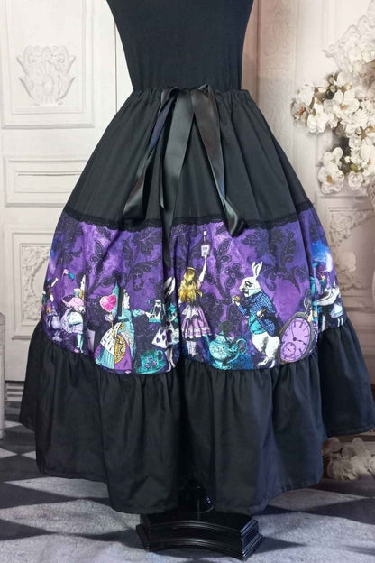 dark purple damask print background overlaid with colourful characters of Alice in Wonderland on a tea length gothic skirt