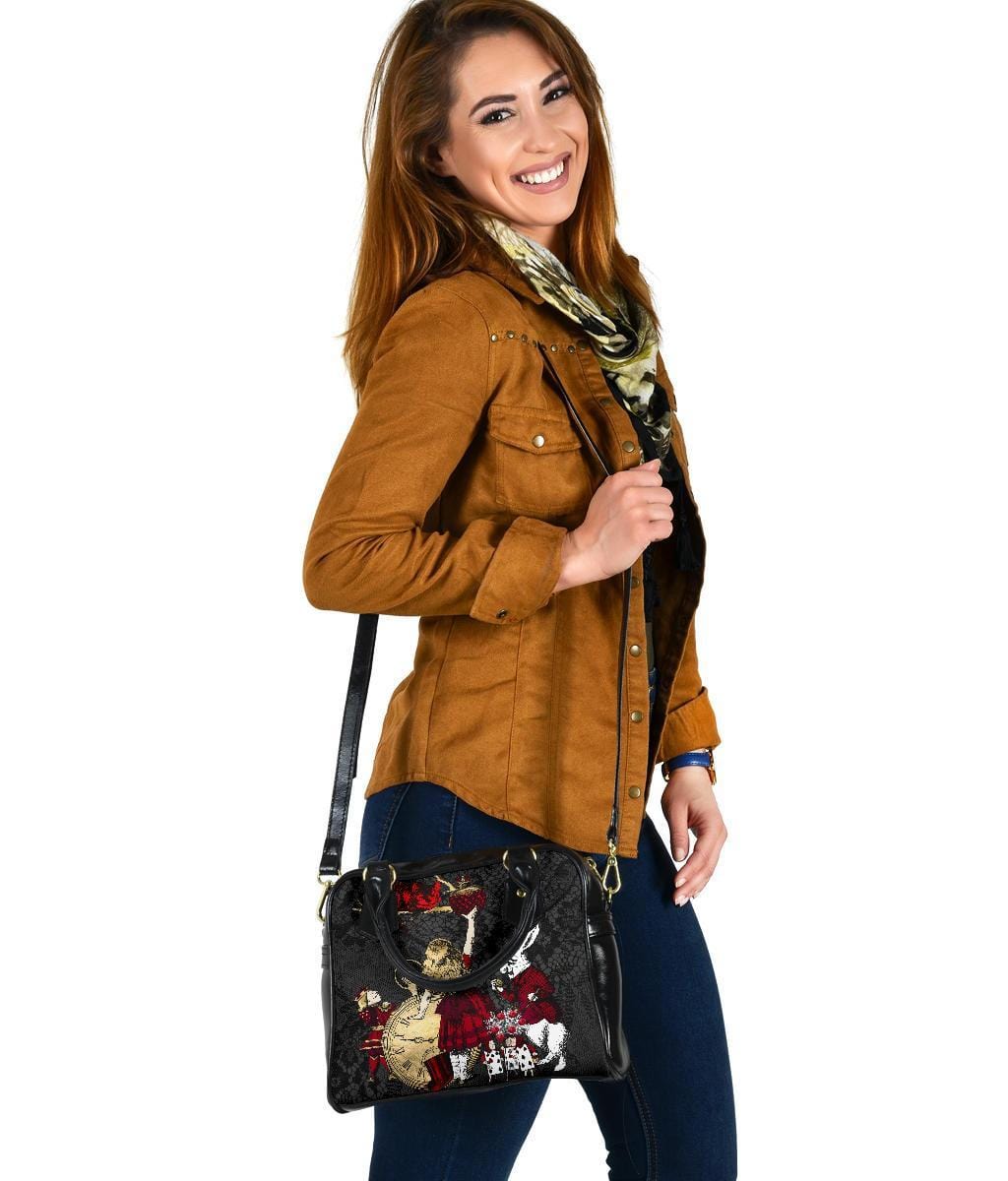 woman wearing the Gothic Alice in Wonderland in red gold black with a white rabbit handbag gift with the long shoulder strap