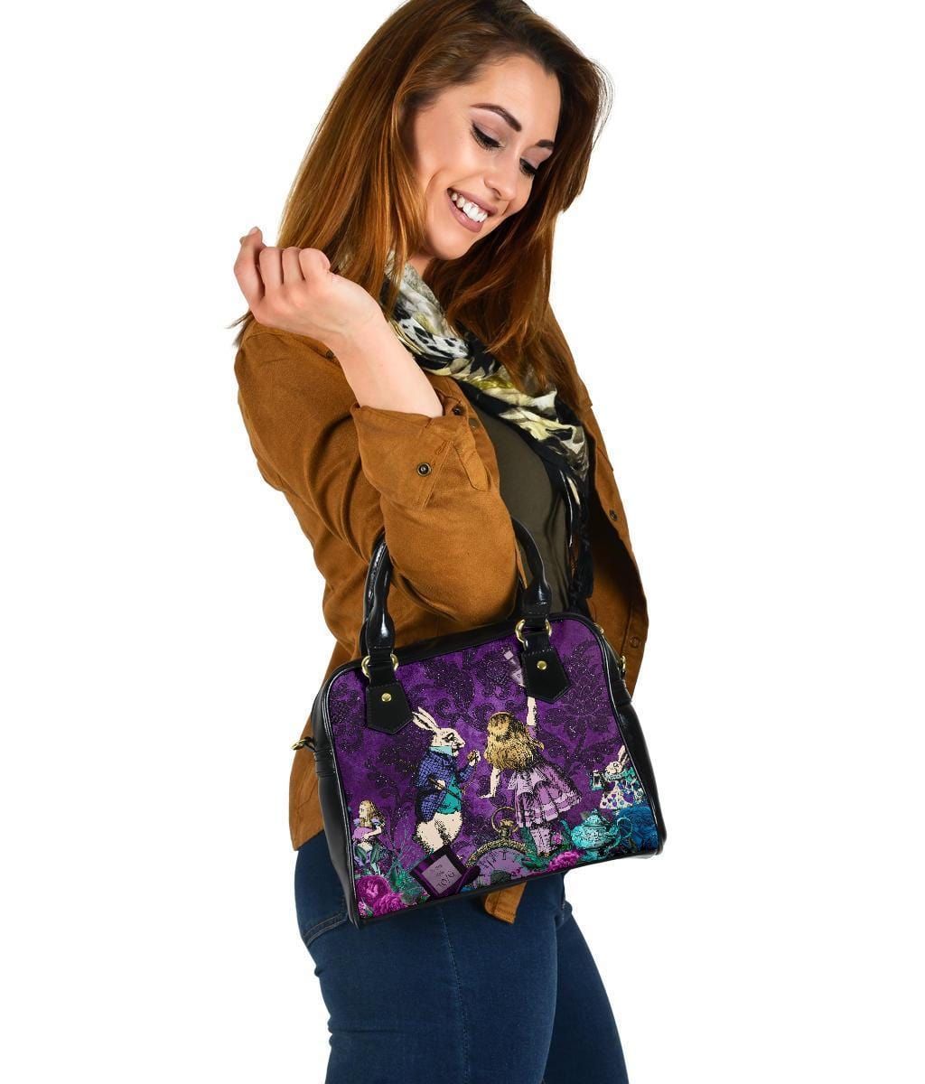 woman looking at her birthday present of the Gothic cute Alice in Wonderland vegan handbag on a purple damask pattern background