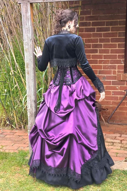 model wearing the Majestica gothic black velvet braid trimmed bolero with an amethyst victorian bustle skirt from Gallery Serpentine
