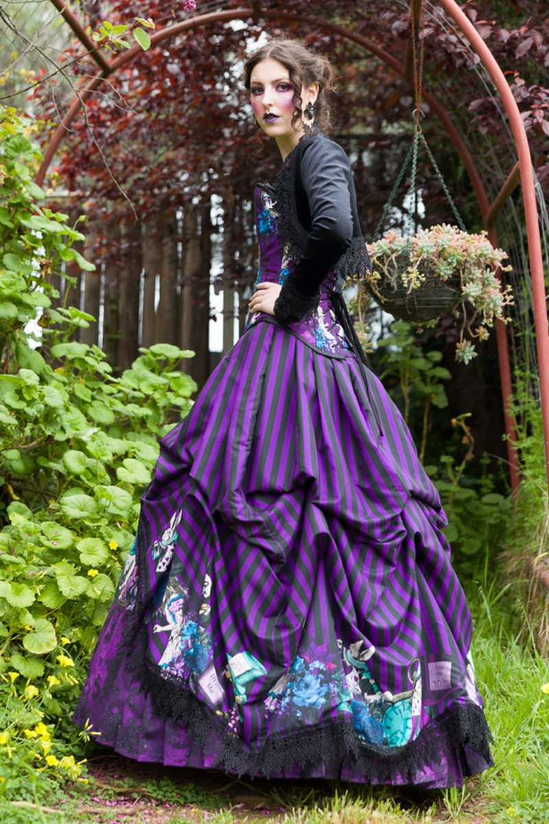 Alice in Wonderland prom gown in purple and black with all the characters included in the design