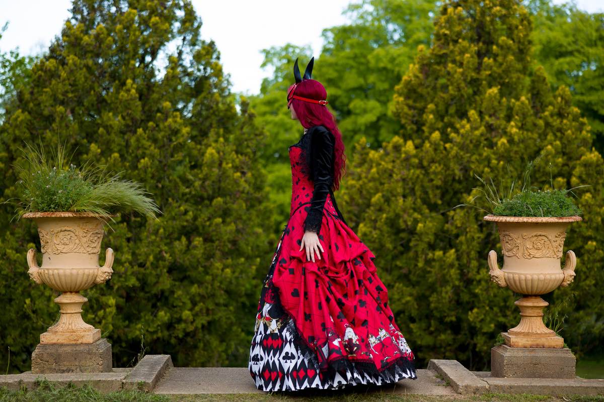 side view of the custom sized made to measure red black and white Alice in Wonderland Queen of Hearts victorian corset gown wedding dress made in Australia