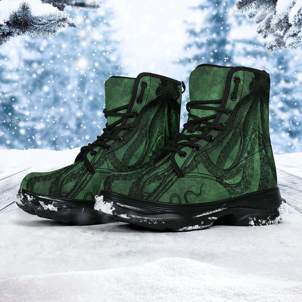 walking in the snow in the chunky style unisex vegan leather goth boots with a sea green Kraken print