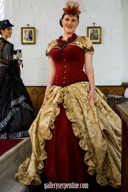 plus size model wearing the Red Velvet steel boned custom sized Australian made corset in a fashion show