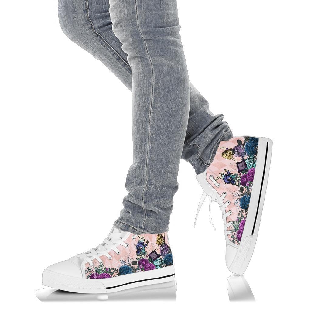 Soft pink Alice in Wonderland high top sneakers worn with stretch skinny jeans