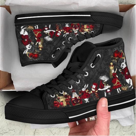 teenager unboxing a gift of the ALICE IN WONDERLAND WHITE RABBIT HI TOP BLACK RED GOLD SNEAKERS