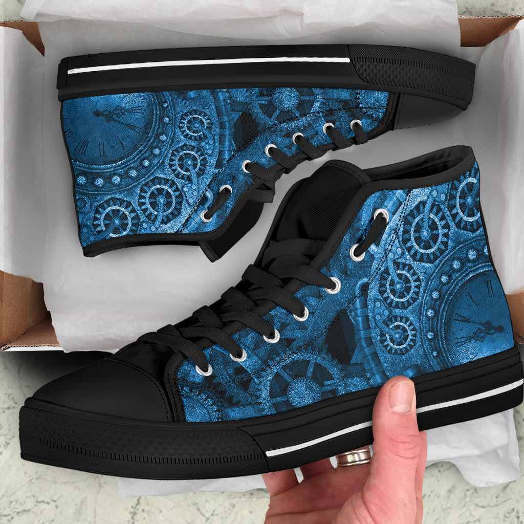 man unboxing his birthday present of the blue clockwork steampunk canvas men's sneakers
