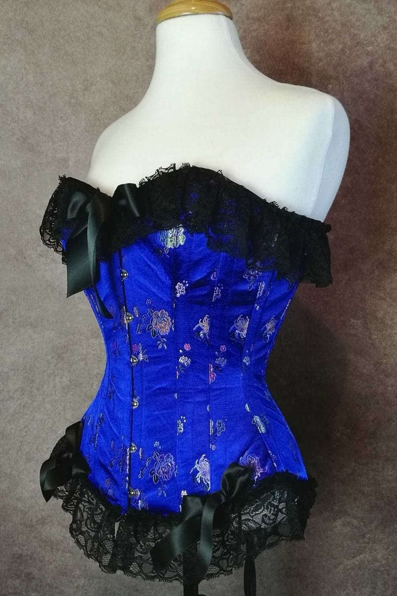 Beautiful in Blue oriental brocade steel boned over bust trimmed with black lace at edges