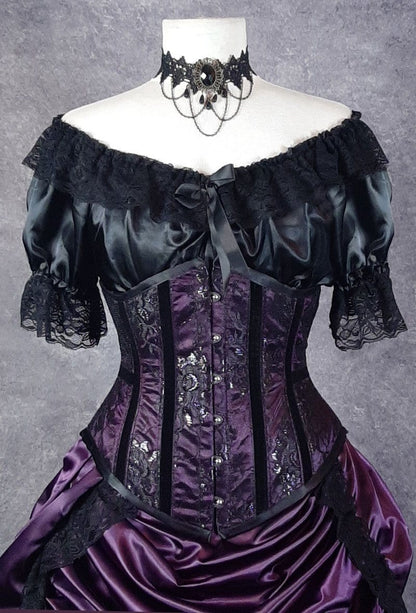 victorian era inspired under corset top called a 'Chemise' made in Australia from black satin and trimmed with black lace worn with an under bust corset in dark purple satin overlaid with black lace