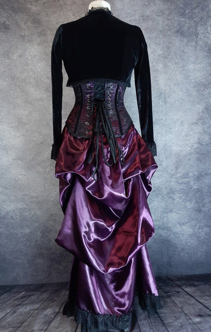 back view of the Amethyst Beauty Victorian Bustle Skirt and matching steel boned under bust corset set made from amethyst satin, shown on a dressmaker's form
