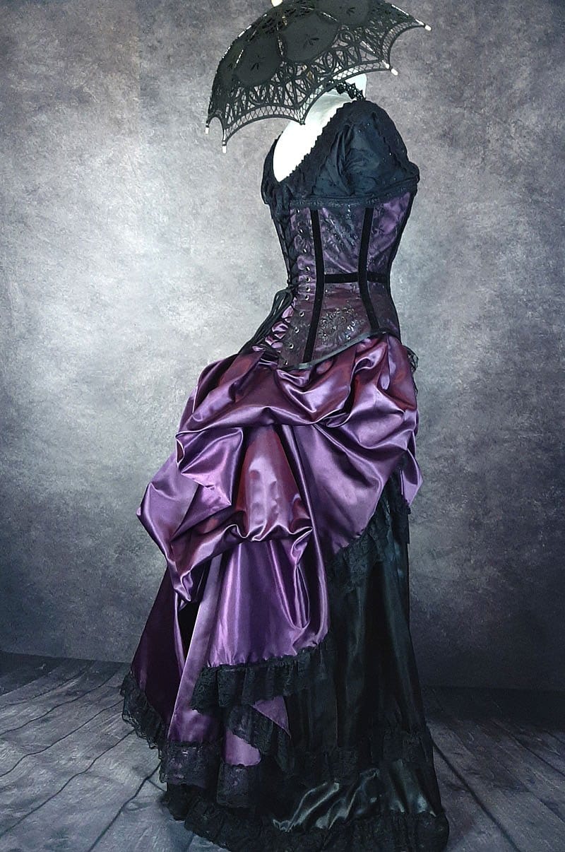 drapery in the victorian bustle skirt made from amethyst purple satin trimmed with black lace