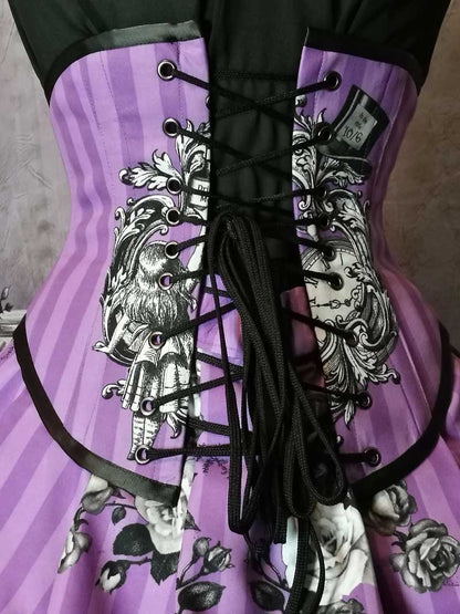 close up view of the back lacing of the corset as part of the Violet coloured custom printed and made Alice in Wonderland fabric made into a steel boned under bust corset and matching  Victorian high low bustle skirt