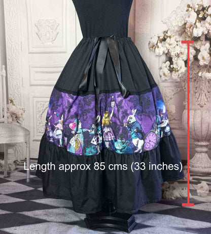 dark purple damask print background overlaid with colourful characters of Alice in Wonderland on a tea length multi size gothic skirt 