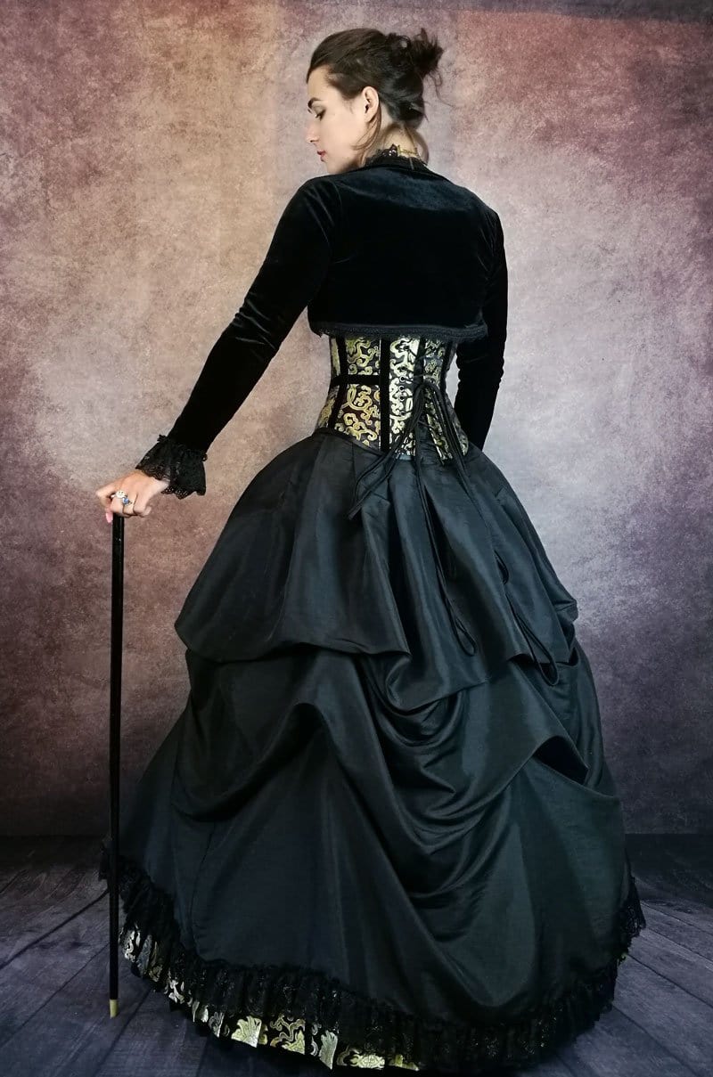 side back view of the Golden Majestica Palace Gown in black & gold brocade with Gallery Serpentine corset