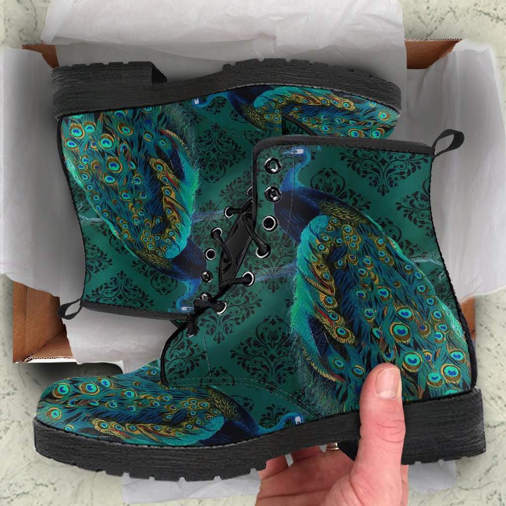 unboxing experience of the green gold jewelled peacock printed custom vegan boots at Gallery Serpentine