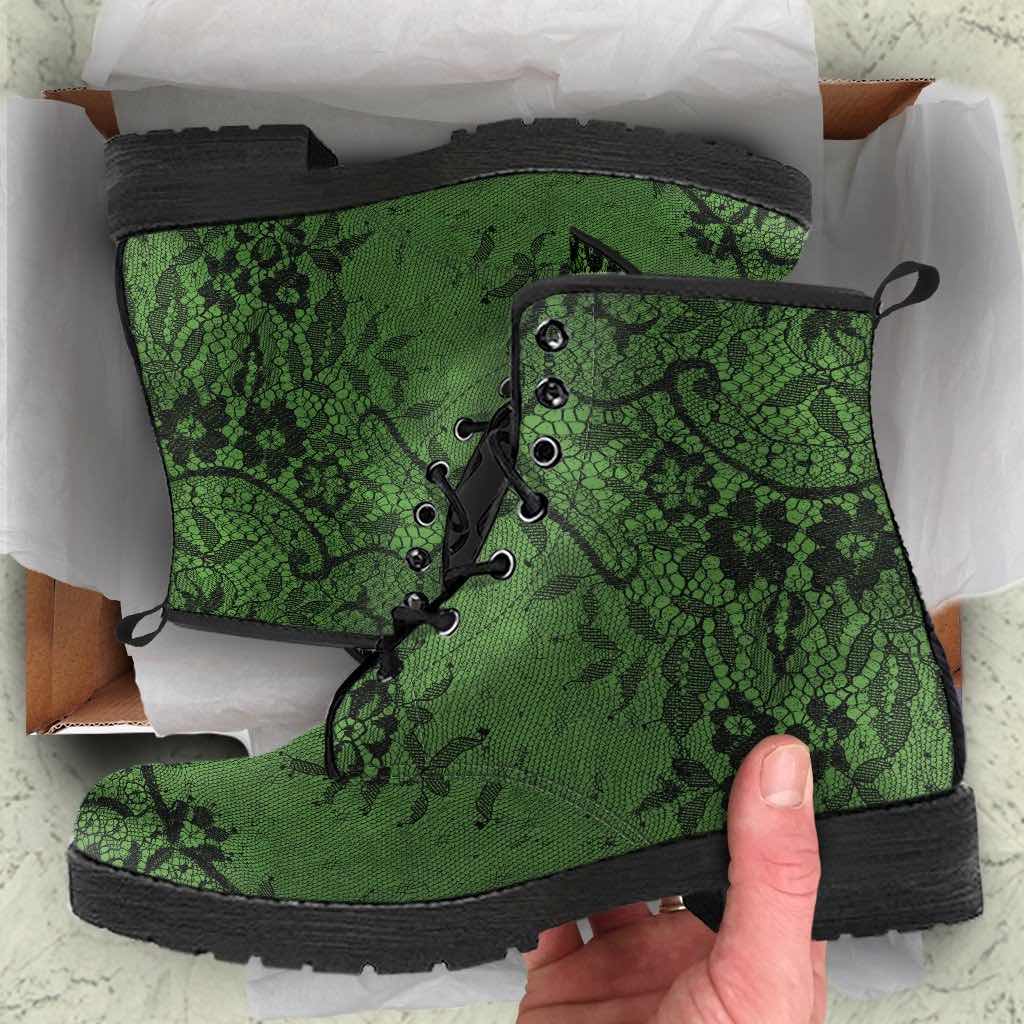 how the green vegan leather boots with a black gothic lace overlay print look when being unboxed