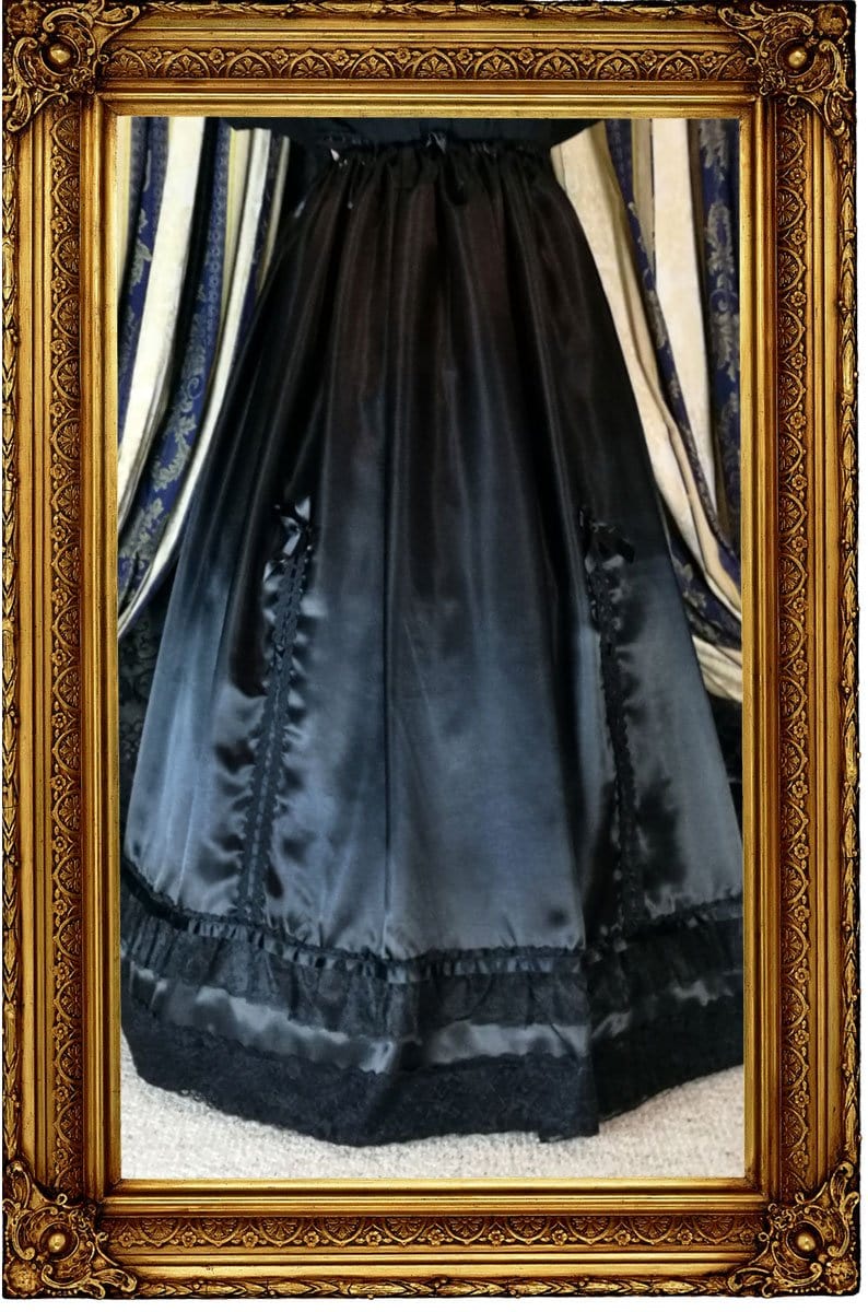 front of the new neo victorian Seraphina skirt in black satin with ribbon braid adjusters worn over a hoop skirt