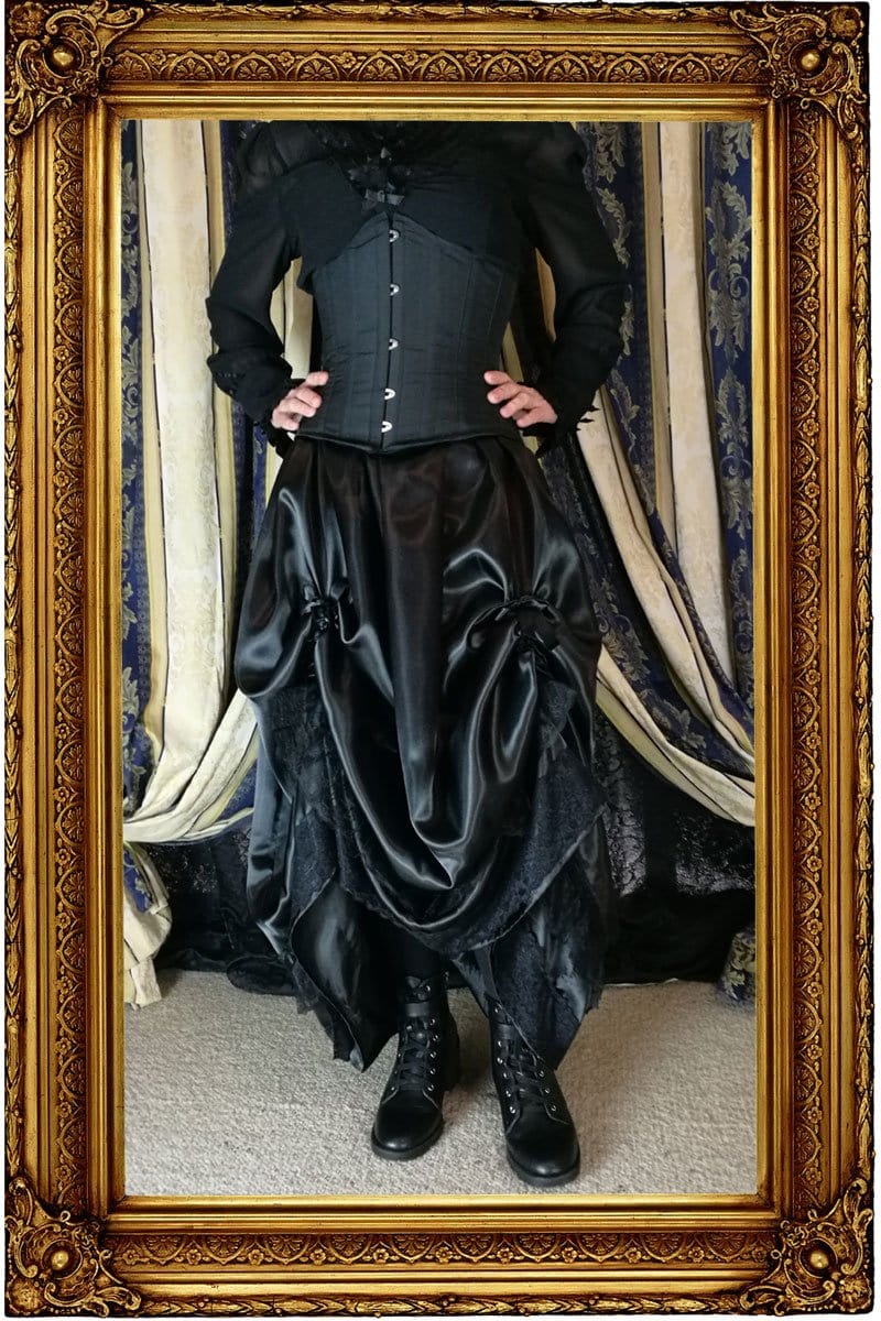 Seraphina neo-victorian multi sized black satin skirt with height adjustability shown worn without a hoop underneath