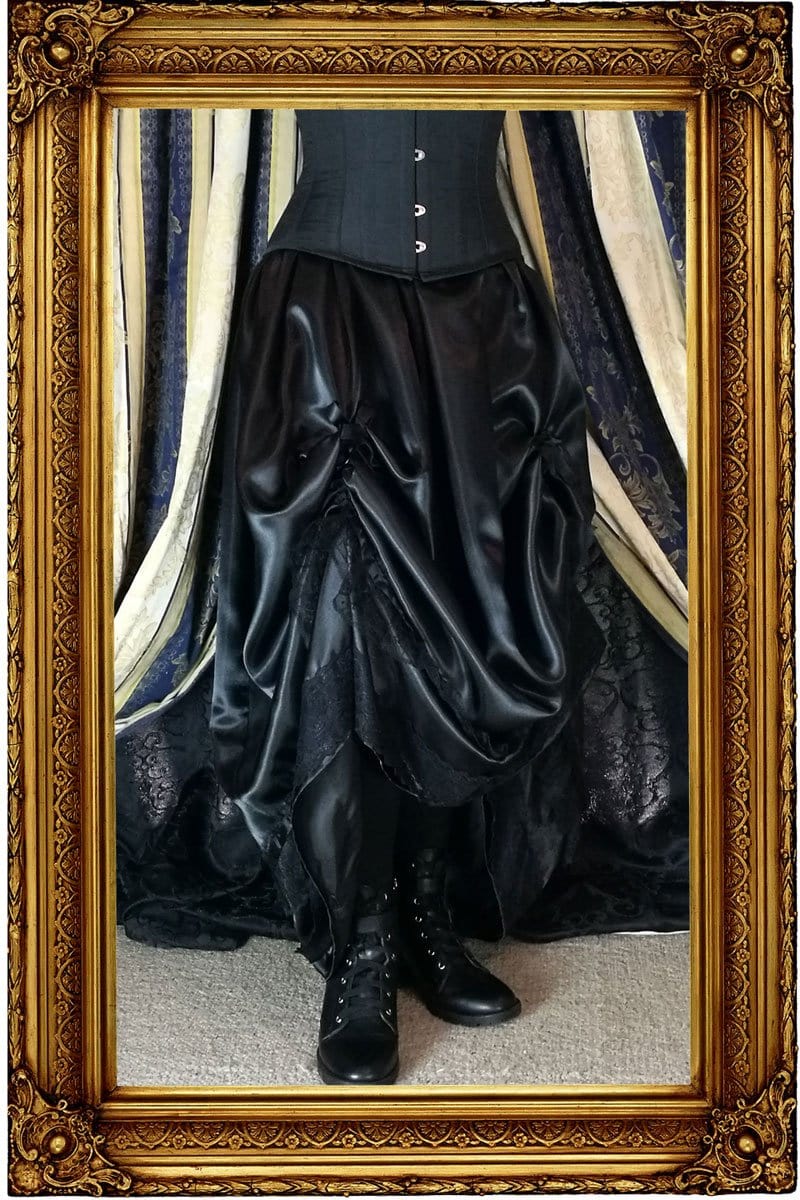 demonstrating how Seraphina skirt looks without a hoop skirt worn underneath so that it shows your victorian boots off