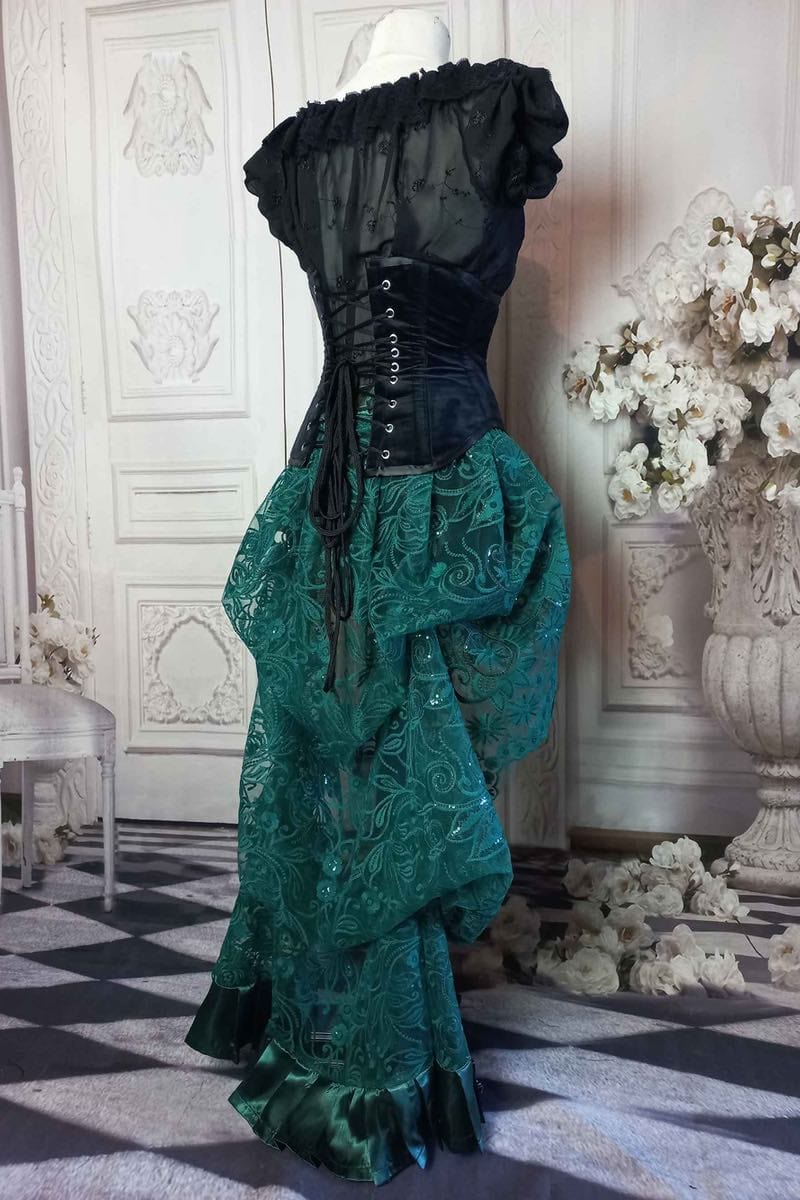 back view of the green lace victorian bustle skirt worn with a black velvet under bust corset from Gallery Serpentine