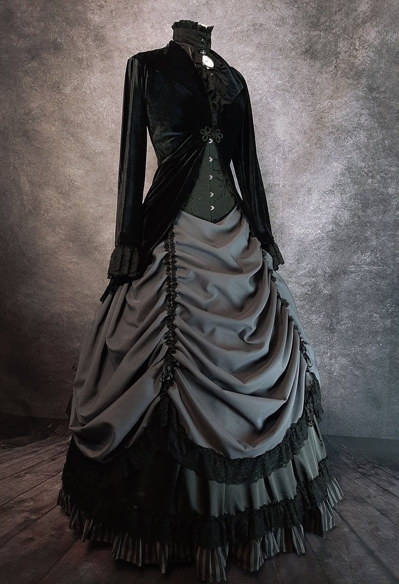 side front view of the black velvet Long Rose Bolero jacket worn over a grey victorian skirt with fully boned hoop underneath