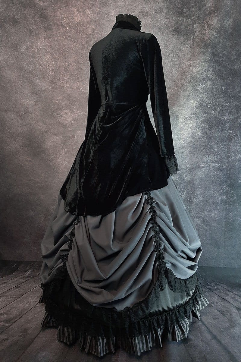 side back view of the Grey Lady gothic victorian skirt set worn with a hoop skirt underneath it and a matching black velvet jacket