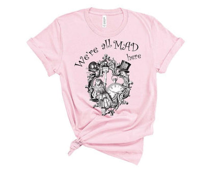 We're All Mad Here quote t-shirt from Alice in Wonderland on soft pink fabric t-shirt