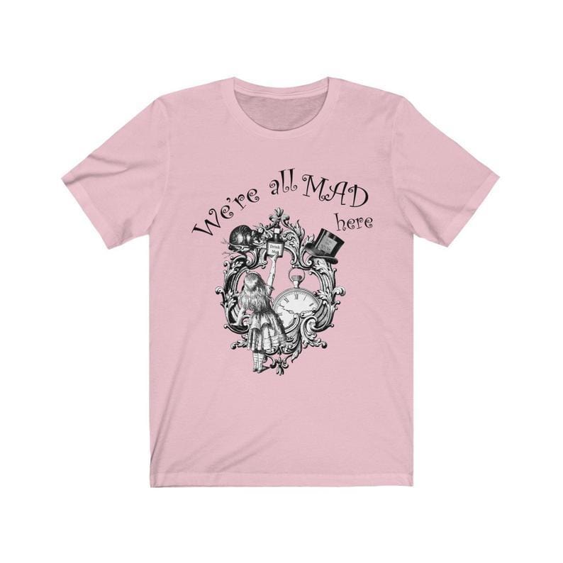 We're All Mad Here quote t-shirt from Alice in Wonderland on flat lay out pink t-shirt