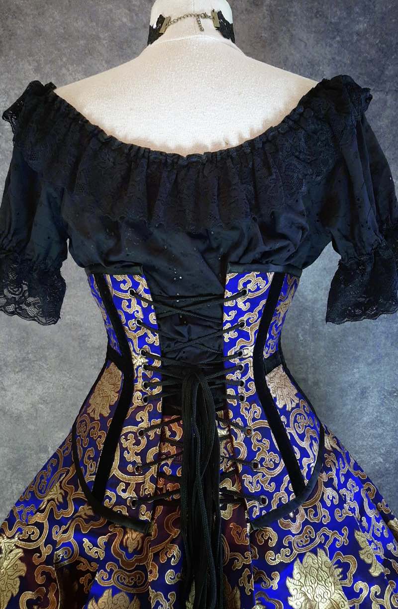 back view of the royal blue and gold steel boned under bust victorian corset showing the corset lacing at the back