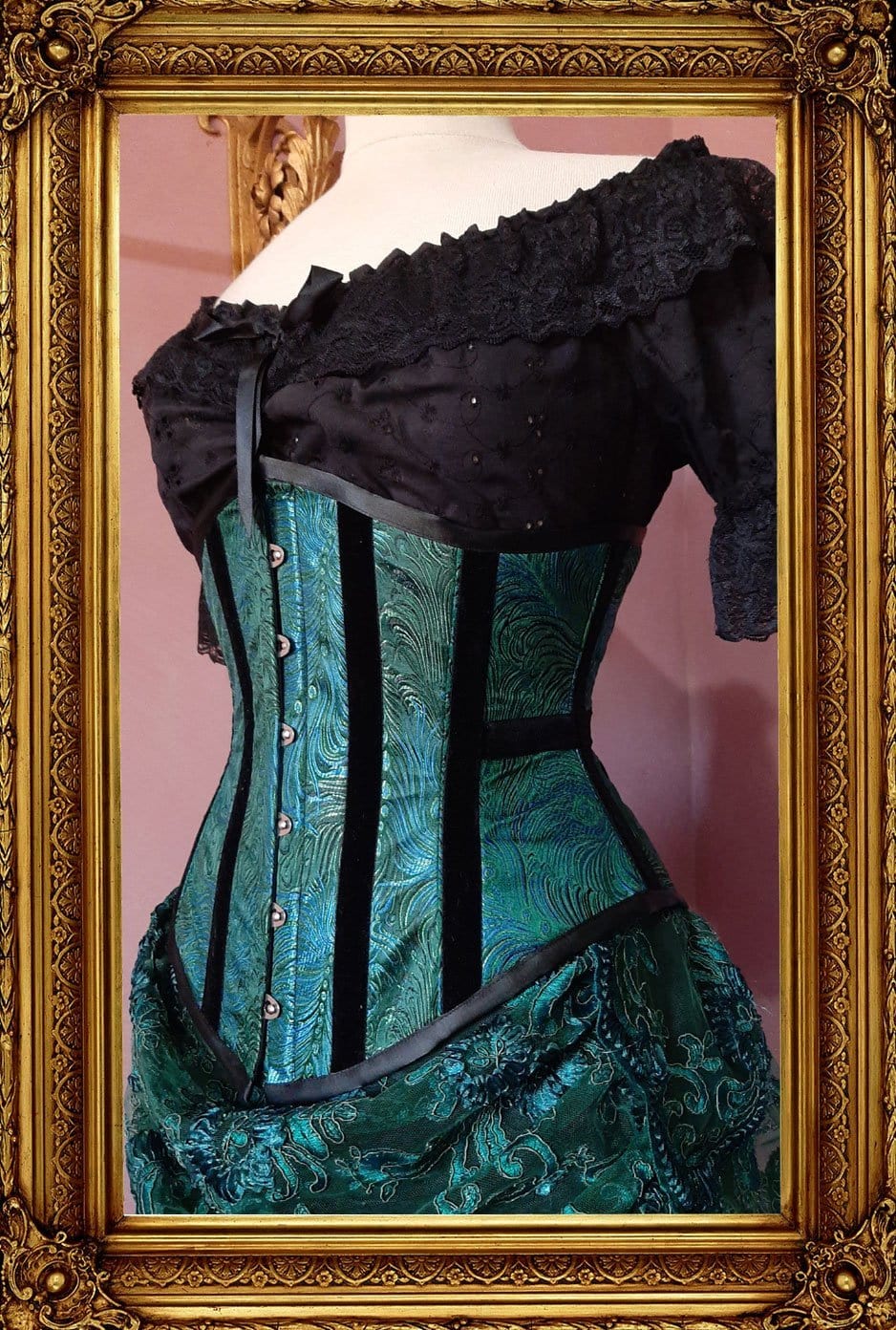 side front view of the awesome peacock brocade under bust corset, trimmed with black velvet