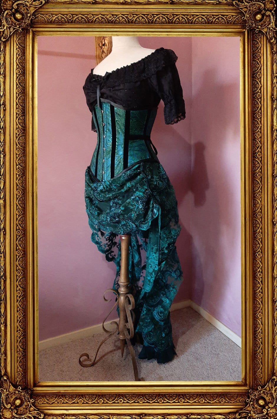 side front view of the peacock brocade corset worn with the matching green lace victorian bustle skirt