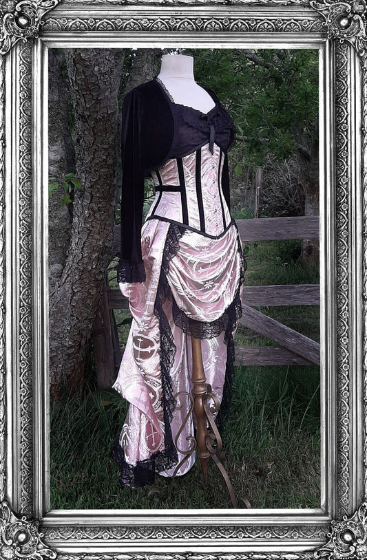 new pink renaissance brocade victorian under bust corset and matching Victorian Bustle Skirt on a mannequin in outdoor setting