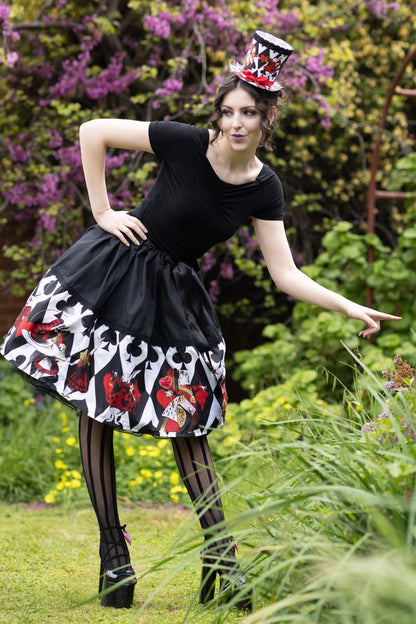 Queen of Hearts and Playing Cards from Alice in Wonderland feature on this red white black gold mid length tea party skirt from Gallery Serpentine