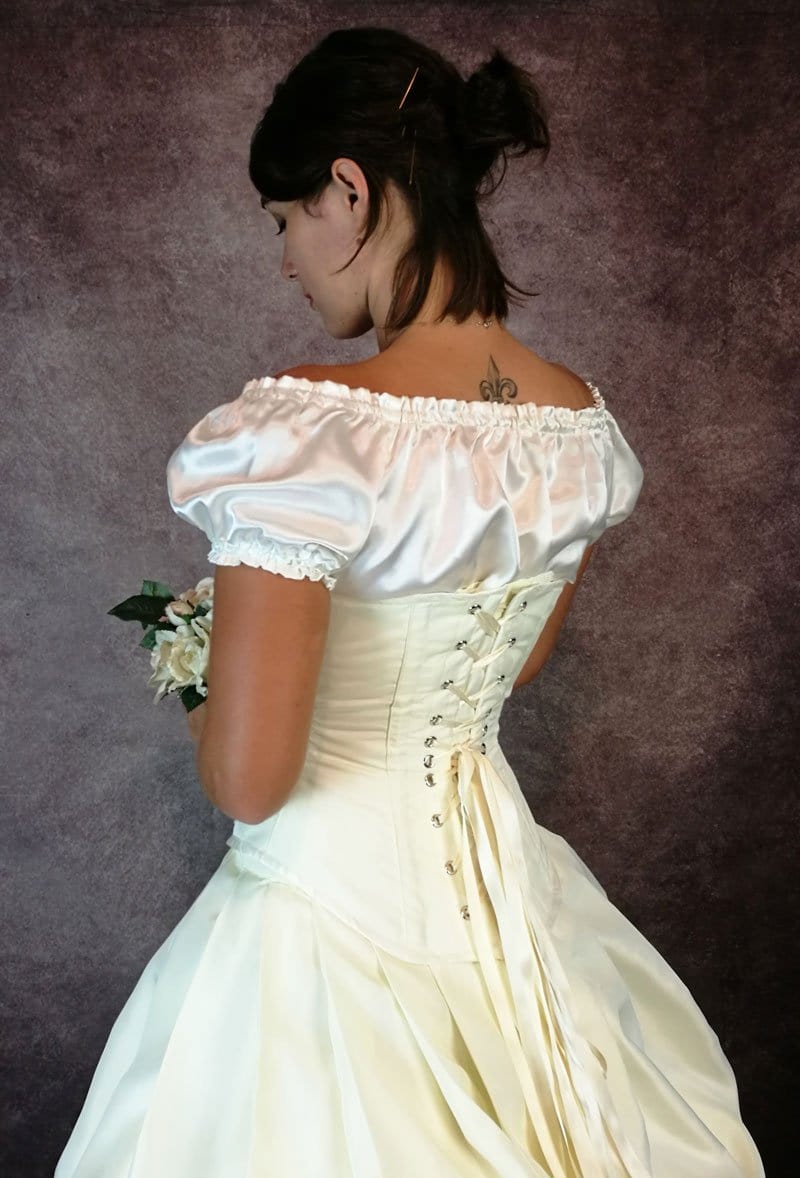 side back view showing the back of the Ivory Majestica steampunk victorian wedding dress