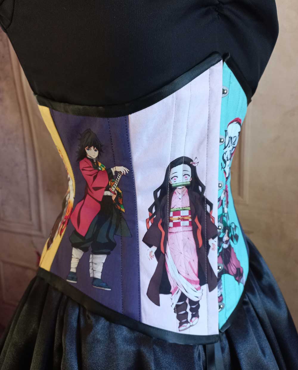 other side front of the Demon Slayer corset featuring two different characters