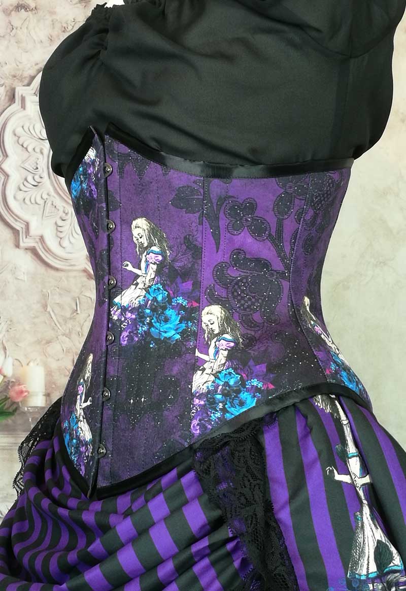 front side close up on the curve of the steel boned Alice in Wonderland corset in purples with turquoise high lights for the Alice character