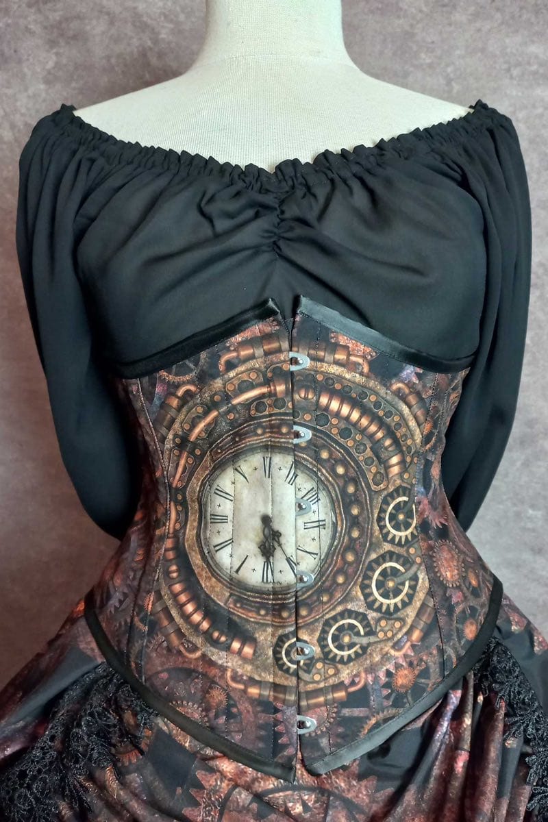 close up on the corset featuring the clock face as part of the Steampunk Cogs Clockwork victorian bustle skirt and matching under bust corset made in Australia