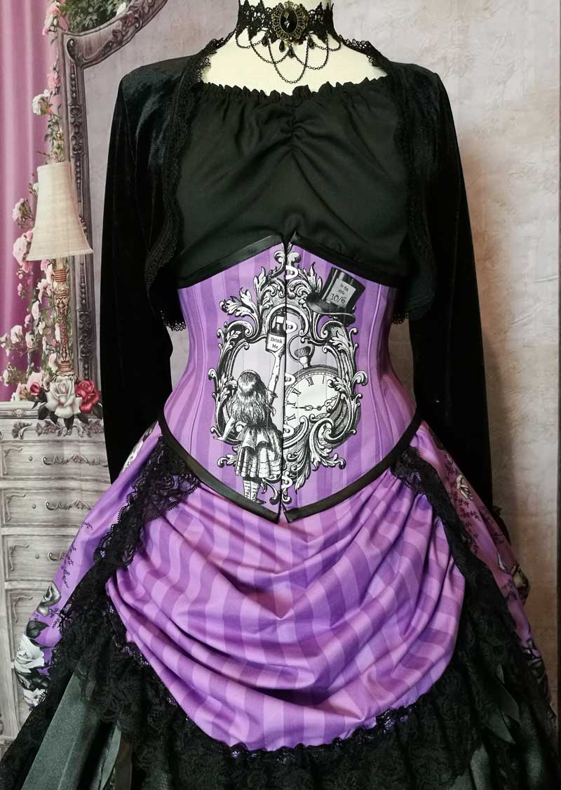 close up on the corset of the Violet coloured custom printed and made Alice in Wonderland fabric made into a steel boned under bust corset and matching  Victorian high low bustle skirt