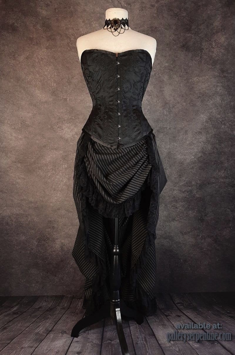 full front view of over bust black Venus corset worn with a high low victorian bustle skirt