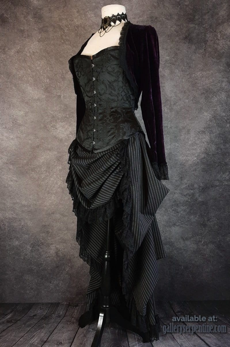 side view of the Venus over bust steel boned corset made in Australia worn with a dark purple velvet Bolero and draping victorian style bustle skirt