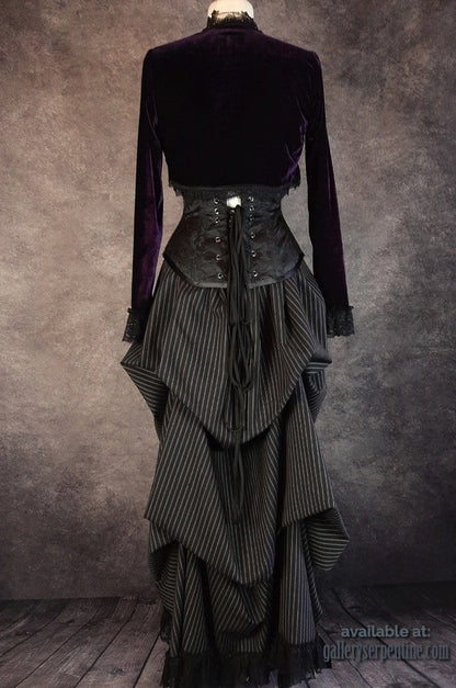 full length back view of a purple velvet bolero worn over the Venus over bust black brocade corset
